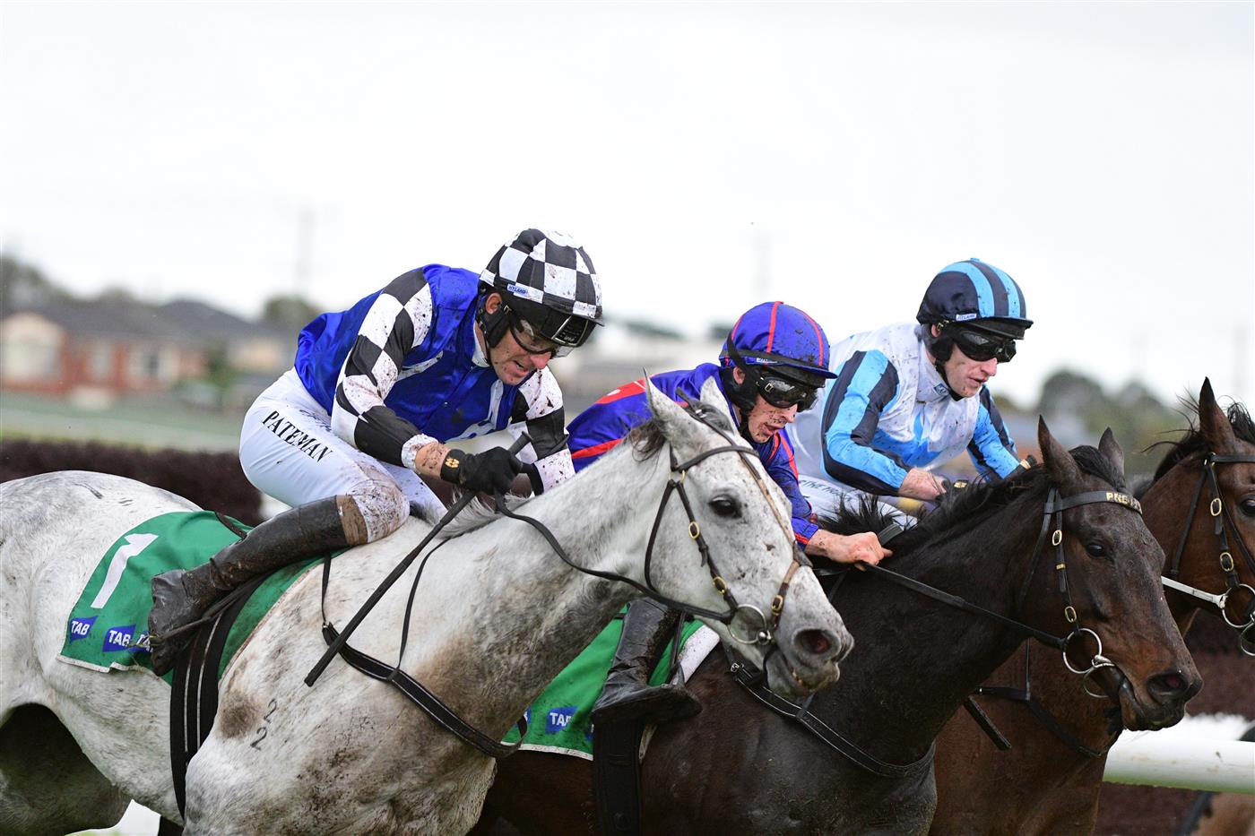 WARRNAMBOOL, AUSTRALIA - MAY 04: Steven Pateman riding Saunter Boy races to win from Will Gordon riding St Arnicca and Lee Horner riding Out and Dreaming (r) before winning Race 6, the Sovereign Resort Galleywood Hurdle, during Galleywood Hurdle day at Warrnambool Racing Club on May 04, 2022 in Warrnambool, Australia. (Photo by Vince Caligiuri/Getty Images)