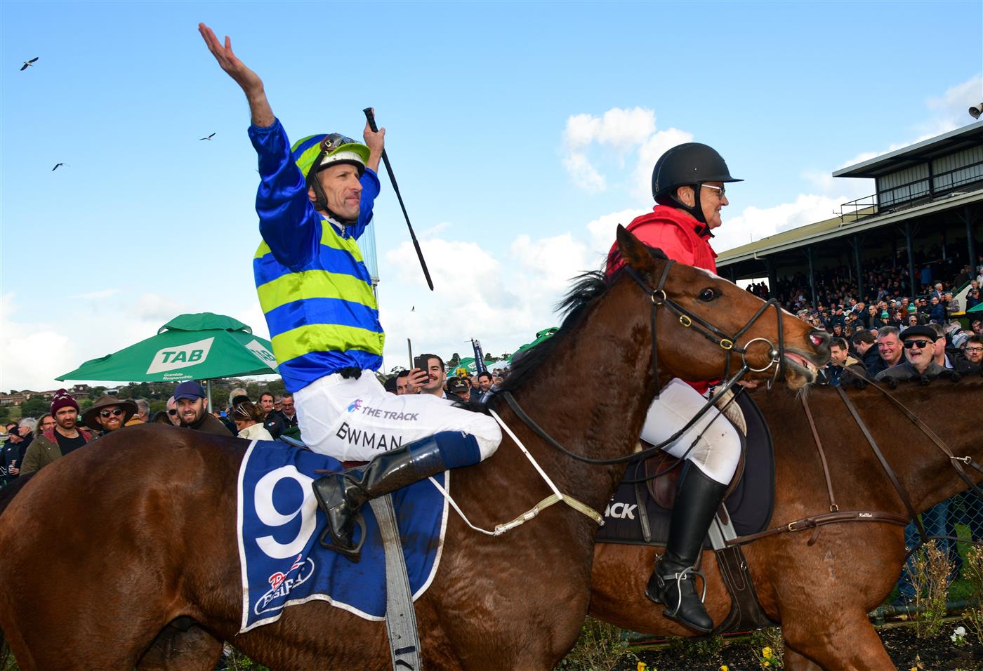 WARRNAMBOOL, AUSTRALIA - MAY 04: Hugh Bowman riding Flash Flood reacts to the crowd after winning Race 9, the Prydes Easifeed Bm70 Handicap,  during Galleywood Hurdle day at Warrnambool Racing Club on May 04, 2022 in Warrnambool, Australia. (Photo by Vince Caligiuri/Getty Images)