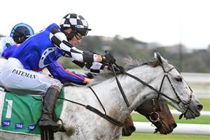 WARRNAMBOOL, AUSTRALIA - MAY 04: Steven Pateman riding Saunter Boy (r) races to win Race 6, the Sovereign Resort Galleywood Hurdle, during Galleywood Hurdle day at Warrnambool Racing Club on May 04, 2022 in Warrnambool, Australia. (Photo by Vince Caligiuri/Getty Images)