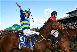 WARRNAMBOOL, AUSTRALIA - MAY 04: Hugh Bowman riding Flash Flood reacts to the crowd after winning Race 9, the Prydes Easifeed Bm70 Handicap, during Galleywood Hurdle day at Warrnambool Racing Club on May 04, 2022 in Warrnambool, Australia. (Photo by Vince Caligiuri/Getty Images)