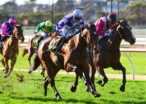 WARRNAMBOOL, AUSTRALIA - MAY 04: Madison Lloyd riding Frankie Pinot defeats Damien Oliver riding Showmanship (3rd place) in Race 8, the The Midfield Group Wangoom Handicap, during Galleywood Hurdle day at Warrnambool Racing Club on May 04, 2022 in Warrnambool, Australia. (Photo by Vince Caligiuri/Getty Images)