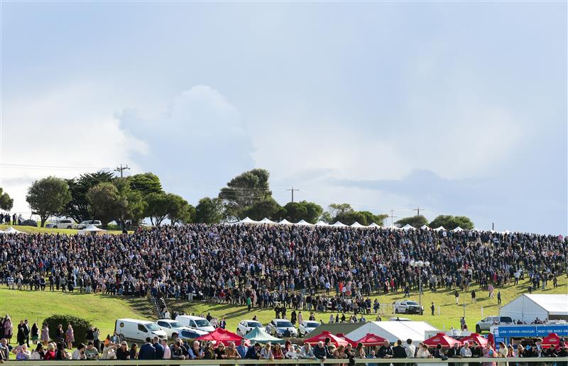 WARRNAMBOOL, AUSTRALIA - MAY 05:  General view of huge crowd on the hill before Race 7, the Lyndoch Living Grand Annual Steeplechase, during Grand Annual day at Warrnambool Racing Club on May 05, 2022 in Warrnambool, Australia. (Photo by Vince Caligiuri/Getty Images)