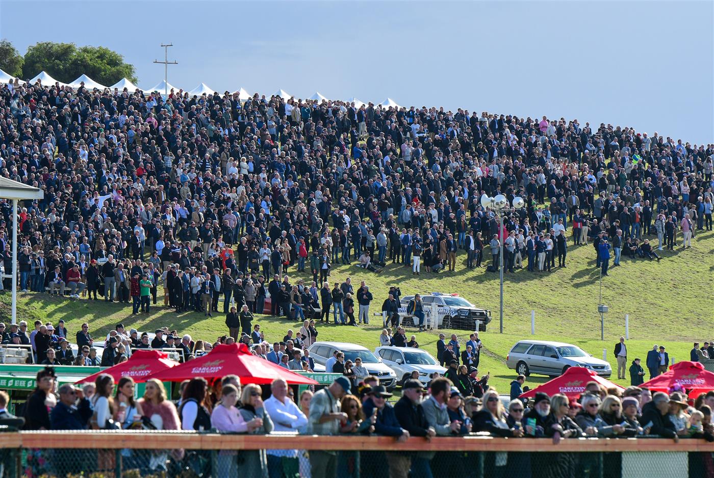 WARRNAMBOOL, AUSTRALIA - MAY 05:  General view of huge crowd on the hill before Race 7, the Lyndoch Living Grand Annual Steeplechase, during Grand Annual day at Warrnambool Racing Club on May 05, 2022 in Warrnambool, Australia. (Photo by Vince Caligiuri/Getty Images)