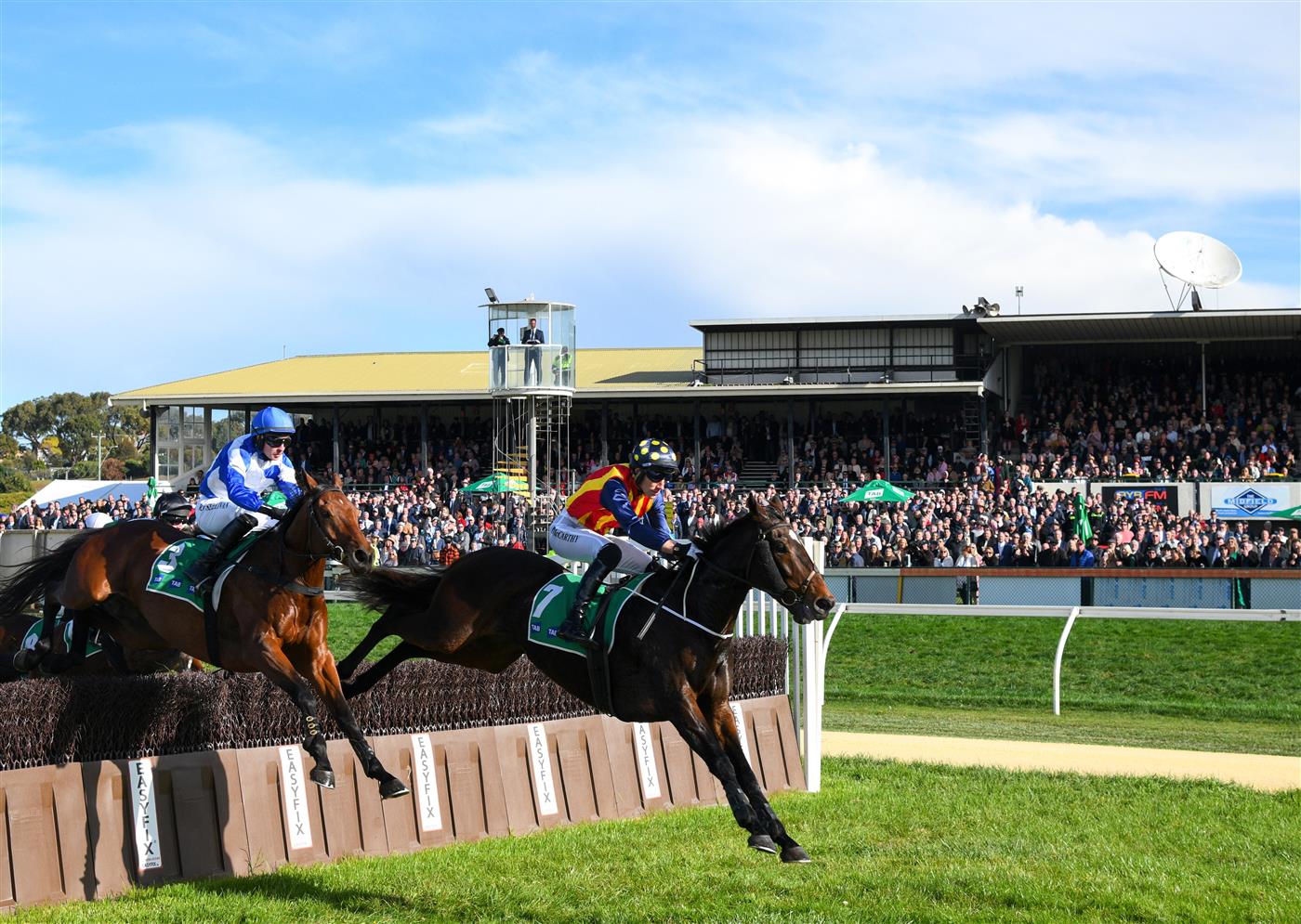 WARRNAMBOOL, AUSTRALIA - MAY 05:  William McCarthy riding Heberite (r) jumping during win in Race 7, the Lyndoch Living Grand Annual Steeplechase, during Grand Annual day at Warrnambool Racing Club on May 05, 2022 in Warrnambool, Australia. (Photo by Vince Caligiuri/Getty Images)