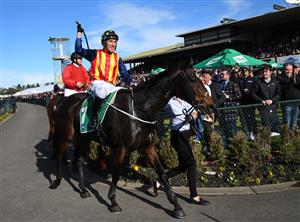 WARRNAMBOOL, AUSTRALIA - MAY 05: William McCarthy riding Heberite after winning Race 7, the Lyndoch Living Grand Annual Steeplechase, during Grand Annual day at Warrnambool Racing Club on May 05, 2022 in Warrnambool, Australia. (Photo by Vince Caligiuri/Getty Images)