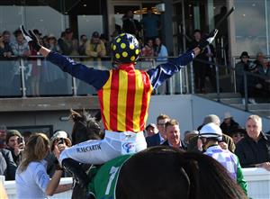 WARRNAMBOOL, AUSTRALIA - MAY 05: William McCarthy riding Heberite after winning Race 7, the Lyndoch Living Grand Annual Steeplechase, during Grand Annual day at Warrnambool Racing Club on May 05, 2022 in Warrnambool, Australia. (Photo by Vince Caligiuri/Getty Images)