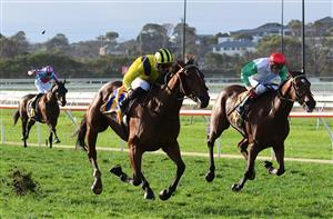 WARRNAMBOOL, AUSTRALIA - MAY 05: Beau Mertens riding Witchachar Star defeats Regan Bayliss riding Nerve Not Verve in Race 9, the Sungold Milk Warrnambool Cup, during Grand Annual day at Warrnambool Racing Club on May 05, 2022 in Warrnambool, Australia. (Photo by Vince Caligiuri/Getty Images)