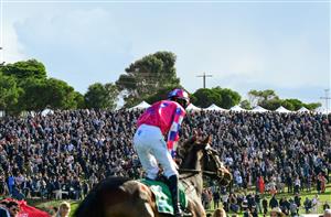 WARRNAMBOOL, AUSTRALIA - MAY 05: Richard O'Donoghue on My King's Counsel on the way to the start of the Lyndoch Living Grand Annual Steeplechase, during Grand Annual day at Warrnambool Racing Club on May 05, 2022 in Warrnambool, Australia. (Getty)