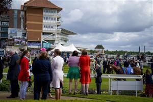 YORK, ENGLAND - MAY 11: Racegoers look into the parade ring at York Racecourse on May 11, 2022 in York, England. (Photo by Alan Crowhurst/Getty Images)