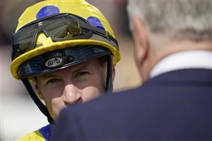 YORK, ENGLAND - MAY 12: Richard Kingscote chats with trainer Michael Stoute after riding Desert Crown to Victory in The Al Basti Equiworld Dubai Dante Stakes at York Racecourse on May 12, 2022 in York, England. (Photo by Alan Crowhurst/Getty Images)