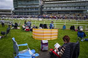 YORK, ENGLAND - MAY 13: A general view as racegoers in the Clocktower Enclosure wait for the start of the first race at York Racecourse on May 13, 2022 in York, England. (Photo by Alan Crowhurst/Getty Images)