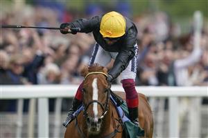 YORK, ENGLAND - MAY 13: Frankie Dettori celebrates victory as he rides Stradivarius to win The Paddy Power Yorkshire Cup Stakes at York Racecourse on May 13, 2022 in York, England. (Photo by Alan Crowhurst/Getty Images)