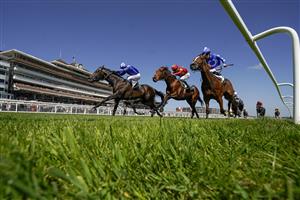 NEWBURY, ENGLAND - MAY 14: Jim Crowley riding Israr (L, blue) win The BetVictor London Gold Cup Handicap at Newbury Racecourse on May 14, 2022 in Newbury, England. (Photo by Alan Crowhurst/Getty Images)