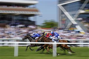 NEWBURY, ENGLAND - MAY 14: Jim Crowley riding Israr (L, blue) win The BetVictor London Gold Cup Handicap at Newbury Racecourse on May 14, 2022 in Newbury, England. (Photo by Alan Crowhurst/Getty Images)