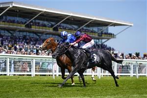 NEWBURY, ENGLAND - MAY 14: Tom Marquand riding Tiber Flow (maroon) win The BetVictor Carnarvon Stakes at Newbury Racecourse on May 14, 2022 in Newbury, England. (Photo by Alan Crowhurst/Getty Images)