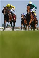 NEWBURY, ENGLAND - MAY 14: Tom Marquand riding Ilaraab (yellow) win The Al Rayyan Stakes at Newbury Racecourse on May 14, 2022 in Newbury, England. (Photo by Alan Crowhurst/Getty Images)