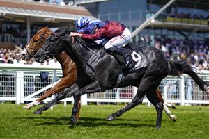 NEWBURY, ENGLAND - MAY 14: Tom Marquand riding Tiber Flow (maroon) win The BetVictor Carnarvon Stakes at Newbury Racecourse on May 14, 2022 in Newbury, England. (Photo by Alan Crowhurst/Getty Images)