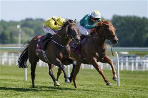 NEWBURY, ENGLAND - MAY 14: Tom Marquand riding Ilaraab (yellow) win The Al Rayyan Stakes at Newbury Racecourse on May 14, 2022 in Newbury, England. (Photo by Alan Crowhurst/Getty Images)