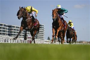 NEWBURY, ENGLAND - MAY 14: Tom Marquand riding Ilaraab (yellow) win The Al Rayyan Stakes at Newbury Racecourse on May 14, 2022 in Newbury, England. (Photo by Alan Crowhurst/Getty Images)