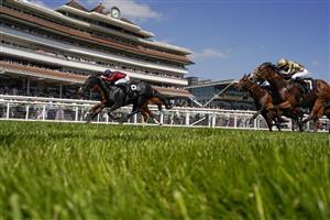 NEWBURY, ENGLAND - MAY 14: Tom Marquand riding Tiber Flow (maroon) win The BetVictor Carnarvon Stakes at Newbury Racecourse on May 14, 2022 in Newbury, England. (Photo by Alan Crowhurst/Getty Images)