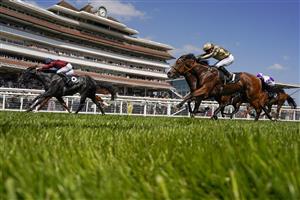 NEWBURY, ENGLAND - MAY 14: Tom Marquand riding Tiber Flow (maroon) win The BetVictor Carnarvon Stakes at Newbury Racecourse on May 14, 2022 in Newbury, England. (Photo by Alan Crowhurst/Getty Images)