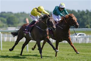NEWBURY, ENGLAND - MAY 14: Tom Marquand riding Ilaraab (yellow) win The Al Rayyan Stakes at Newbury Racecourse on May 14, 2022 in Newbury, England. (Photo by Alan Crowhurst/Getty Images)