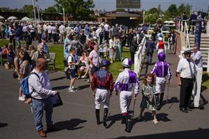 NEWBURY, ENGLAND - MAY 14: A general view as autograph hunters wait for the jockeys as they leave the weighing room at Newbury Racecourse on May 14, 2022 in Newbury, England. (Photo by Alan Crowhurst/Getty Images)