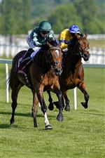 NEWBURY, ENGLAND - MAY 14: Hollie Doyle riding Nashwa (green) win The Haras De Bouquetot Fillies' Trial Stakes at Newbury Racecourse on May 14, 2022 in Newbury, England. (Photo by Alan Crowhurst/Getty Images)