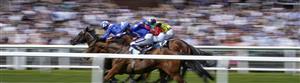 NEWBURY, ENGLAND - MAY 14: Jim Crowley riding Israr (L, blue) win The BetVictor London Gold Cup Handicap at Newbury Racecourse on May 14, 2022 in Newbury, England. (Photo by Alan Crowhurst/Getty Images)