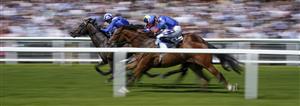 NEWBURY, ENGLAND - MAY 14: Jim Crowley riding Israr (L, blue) win The BetVictor London Gold Cup Handicap at Newbury Racecourse on May 14, 2022 in Newbury, England. (Photo by Alan Crowhurst/Getty Images)