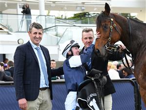 MELBOURNE, AUSTRALIA - MAY 14: Alana Kelly poses with trainer Robert Hickmott after riding Point Nepean to win Race 7, the Lexus Andrew Ramsden, during Melbourne Racing at Flemington Racecourse on May 14, 2022 in Melbourne, Australia. (Photo by Vince Caligiuri/Getty Images)