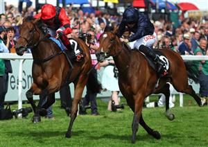 EPSOM, ENGLAND - JUNE 03: Ryan Moore riding Tuesday (R blue) wins The Cazoo Oaks from Frankie Dettori and Emily Up John (L, red) during Ladies Day at Epsom Racecourse on June 03, 2022 in Epsom, England. (Photo by Andrew Redington/Getty Images)