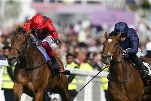EPSOM, ENGLAND - JUNE 03: Ryan Moore riding Tuesday (,R blue) win The Cazoo Oaks from Frankie Dettori and Emily Upjohn (L, red) during Ladies Day at Epsom Racecourse on June 03, 2022 in Epsom, England. (Photo by Alan Crowhurst/Getty Images)