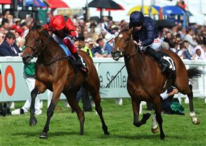 EPSOM, ENGLAND - JUNE 03: Ryan Moore riding Tuesday (R blue) wins The Cazoo Oaks from Frankie Dettori and Emily Up John (L, red) during Ladies Day at Epsom Racecourse on June 03, 2022 in Epsom, England. (Photo by Andrew Redington/Getty Images)