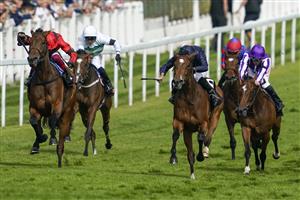 EPSOM, ENGLAND - JUNE 03: Ryan Moore riding Tuesday (, blue) win The Cazoo Oaks from Frankie Dettori and Emily Upjohn (L, red) during Ladies Day at Epsom Racecourse on June 03, 2022 in Epsom, England. (Photo by Alan Crowhurst/Getty Images)