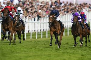 EPSOM, ENGLAND - JUNE 03: Ryan Moore riding Tuesday (C, blue) win The Cazoo Oaks from Frankie Dettori and Emily Upjohn (L, red) during Ladies Day at Epsom Racecourse on June 03, 2022 in Epsom, England. (Photo by Alan Crowhurst/Getty Images)