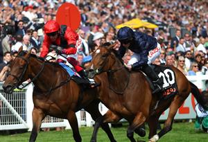 EPSOM, ENGLAND - JUNE 03: Ryan Moore riding Tuesday (R blue) wins The Cazoo Oaks from Frankie Dettori and Emily Up John (L, red) during Ladies Day at Epsom Racecourse on June 03, 2022 in Epsom, England. (Photo by Andrew Redington/Getty Images)