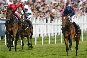 EPSOM, ENGLAND - JUNE 03: Ryan Moore riding Tuesday (R, blue) win The Cazoo Oaks from Frankie Dettori and Emily Upjohn (L, red) during Ladies Day at Epsom Racecourse on June 03, 2022 in Epsom, England. (Photo by Alan Crowhurst/Getty Images)