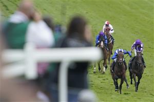 EPSOM, ENGLAND - JUNE 03: Jim Crowley riding Hukum (blue white cap) win The Dahlbury Coronation Cup during Ladies Day at Epsom Racecourse on June 03, 2022 in Epsom, England. (Photo by Alan Crowhurst/Getty Images)