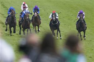 EPSOM, ENGLAND - JUNE 03: Jim Crowley riding Hukum (blue white cap) win The Dahlbury Coronation Cup during Ladies Day at Epsom Racecourse on June 03, 2022 in Epsom, England. (Photo by Alan Crowhurst/Getty Images)