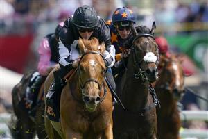 EPSOM, ENGLAND - JUNE 03: William Buick riding Legend Of Xanadu (C, black/white) win The Cazoo Woodcote British EBF Stakes during Ladies Day at Epsom Racecourse on June 03, 2022 in Epsom, England. (Photo by Alan Crowhurst/Getty Images)