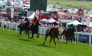 EPSOM, ENGLAND - JUNE 03: William Buick riding Legend of Xanadu (far right) to victory in the Cazoo Woodcote British EBF Stakes during Ladies Day at Epsom Racecourse on June 03, 2022 in Epsom, England. (Photo by Andrew Redington/Getty Images)