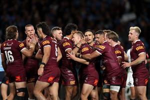 SYDNEY, AUSTRALIA - JUNE 08: Daly Cherry-Evans of the Maroons celebrates with teammates after scoring a try during game one of the 2022 State of Origin series between the New South Wales Blues and the Queensland Maroons at Accor Stadium on June 08, 2022 in Sydney, Australia. (Photo by Cameron Spencer/Getty Images)