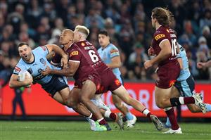 SYDNEY, AUSTRALIA - JUNE 08: James Tedesco of the Blues is tackled by m12during game one of the 2022 State of Origin series between the New South Wales Blues and the Queensland Maroons at Accor Stadium on June 08, 2022 in Sydney, Australia. (Photo by Cameron Spencer/Getty Images)