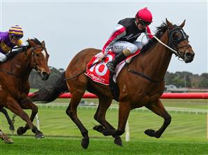 MELBOURNE, AUSTRALIA - JUNE 11: Alana Kelly riding Umgawa winning Race 8, the Ladbrokes Same Race Multi Handicap, during Melbourne Racing at Sandown Hillside on June 11, 2022 in Melbourne, Australia. (Photo by Vince Caligiuri/Getty Images)