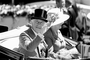 ASCOT, ENGLAND - JUNE 14: (EDITORS NOTE: This image has been converted to black and white.) The Prince of Wales with The Duchess of Cornwall in the royal procession during Royal Ascot 2022 at Ascot Racecourse on June 14, 2022 in Ascot, England. (Photo by John Phillips/Getty Images for Ascot Racecourse)