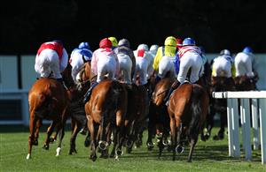 ASCOT, ENGLAND - JUNE 14: Horses and riders take the first bend during The Ascot Stakes during Royal Ascot 2022 at Ascot Racecourse on June 14, 2022 in Ascot, England. (Photo by Alex Livesey/Getty Images)