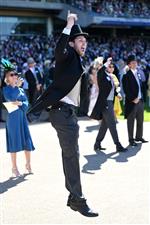 ASCOT, ENGLAND - JUNE 14: A racegoer celebrates a win during Royal Ascot 2022 at Ascot Racecourse on June 14, 2022 in Ascot, England. (Photo by Eamonn M. McCormack/Getty Images for Ascot Racecourse)