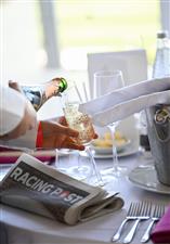 ASCOT, ENGLAND - JUNE 14: A general view of a champagne being poured during Royal Ascot 2022 at Ascot Racecourse on June 14, 2022 in Ascot, England. (Photo by Eamonn M. McCormack/Getty Images for Ascot Racecourse)