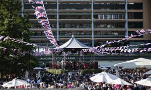 ASCOT, ENGLAND - JUNE 14: Racegoers watch the sing-along at the end of the first day of Royal Ascot 2022 at Ascot Racecourse on June 14, 2022 in Ascot, England. (Photo by John Phillips/Getty Images for Ascot Racecourse)